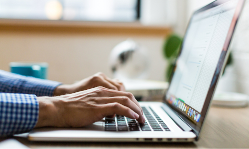 Man typing on laptop